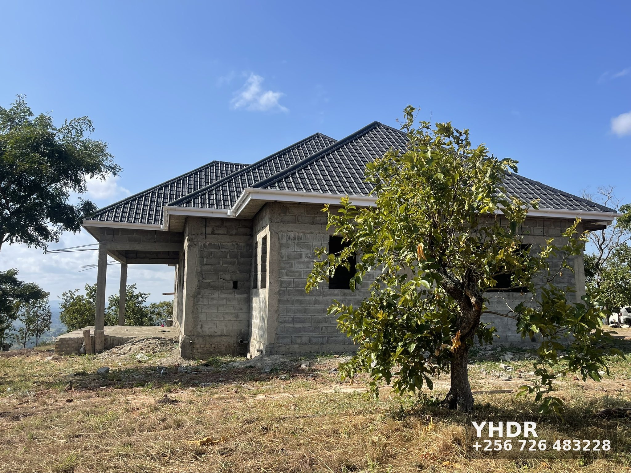 Hillside House Under Construction With Mango Tree YHDR Builders Uganda Ltd 1 - YHDR Builders Co. Limited