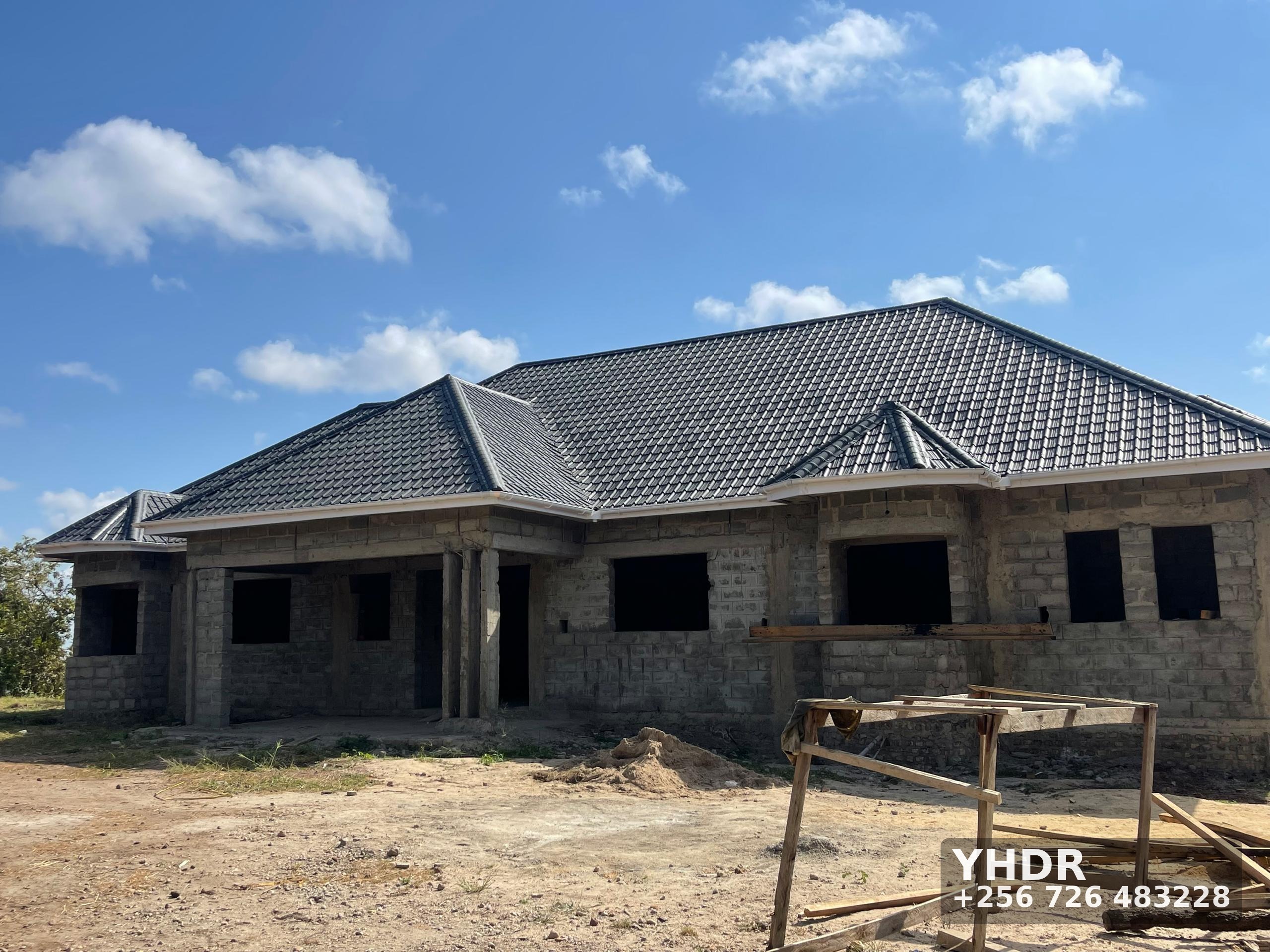 House Under Construction With Block Walls And Tiled Roof YHDR Builders Uganda Ltd 1 - YHDR Builders Co. Limited